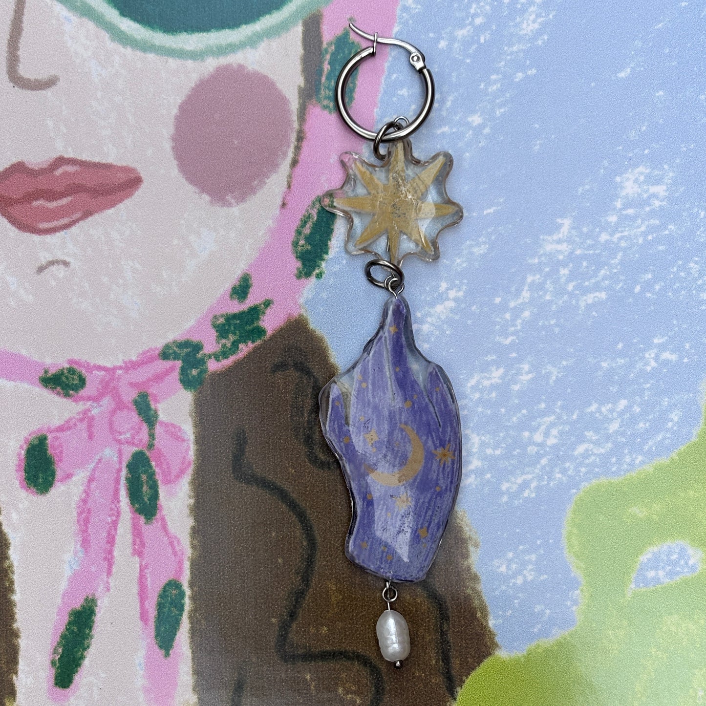 Par de aretes mano mágica