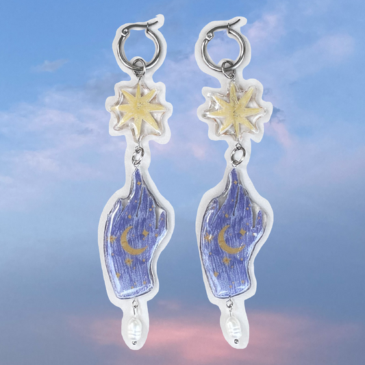Par de aretes mano mágica